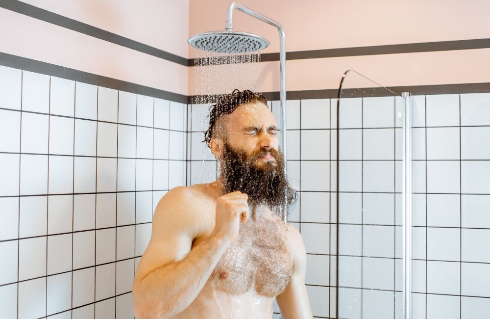 Man Taking a Shower with Cold Water