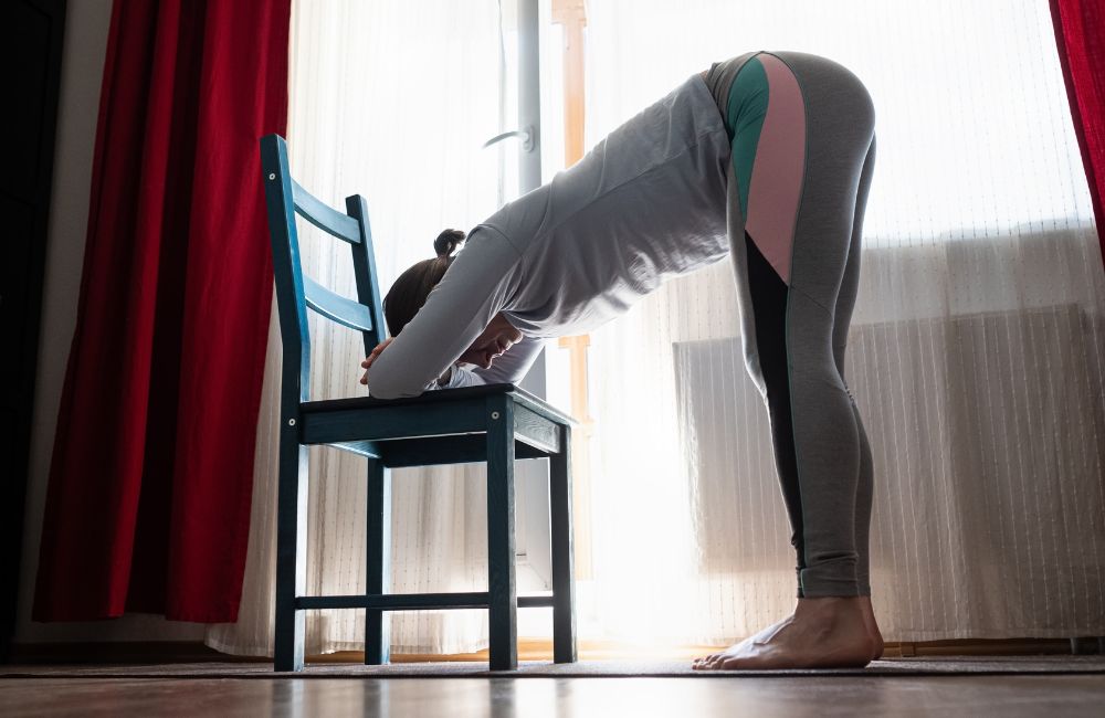 Standing Forward Bend Pose on a Chair